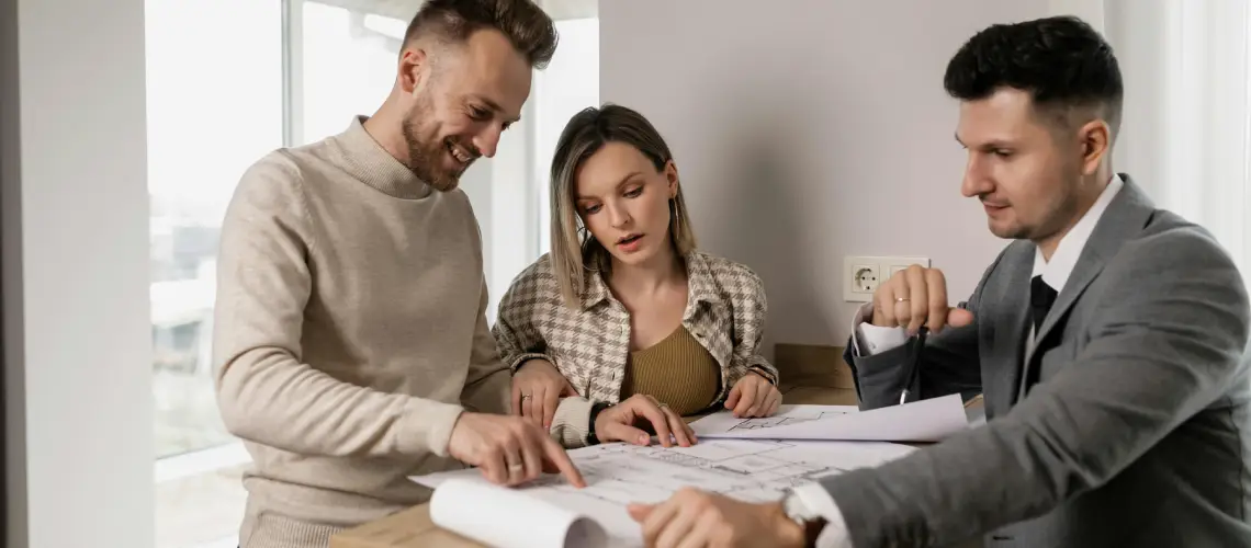 Australian couple meeting a certified property valuer at their home